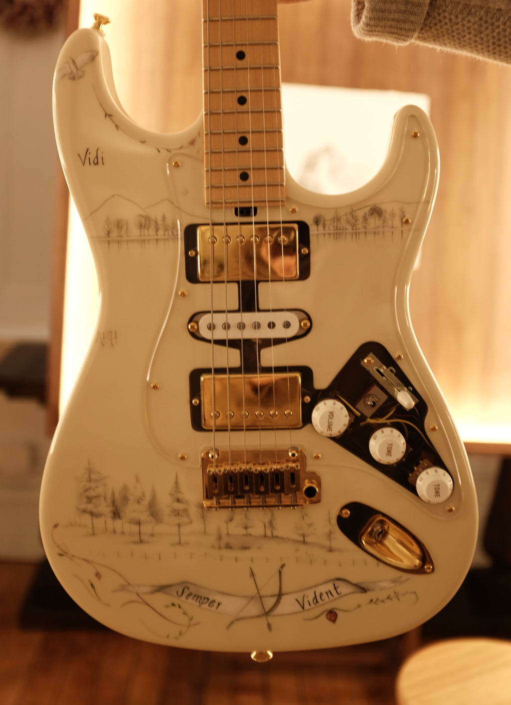 Detail shot of a custom guitar with an ornate pencil design