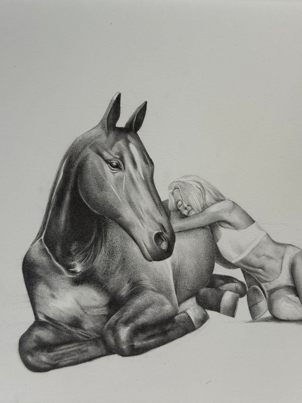 Graphite drawing of a girl laying peacefully with a horse, detail view — The Return, by Kate McDuffie
