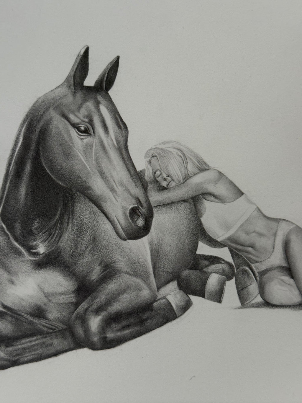 Graphite drawing of a girl laying peacefully with a horse, third detail view — The Return, by Kate McDuffie"