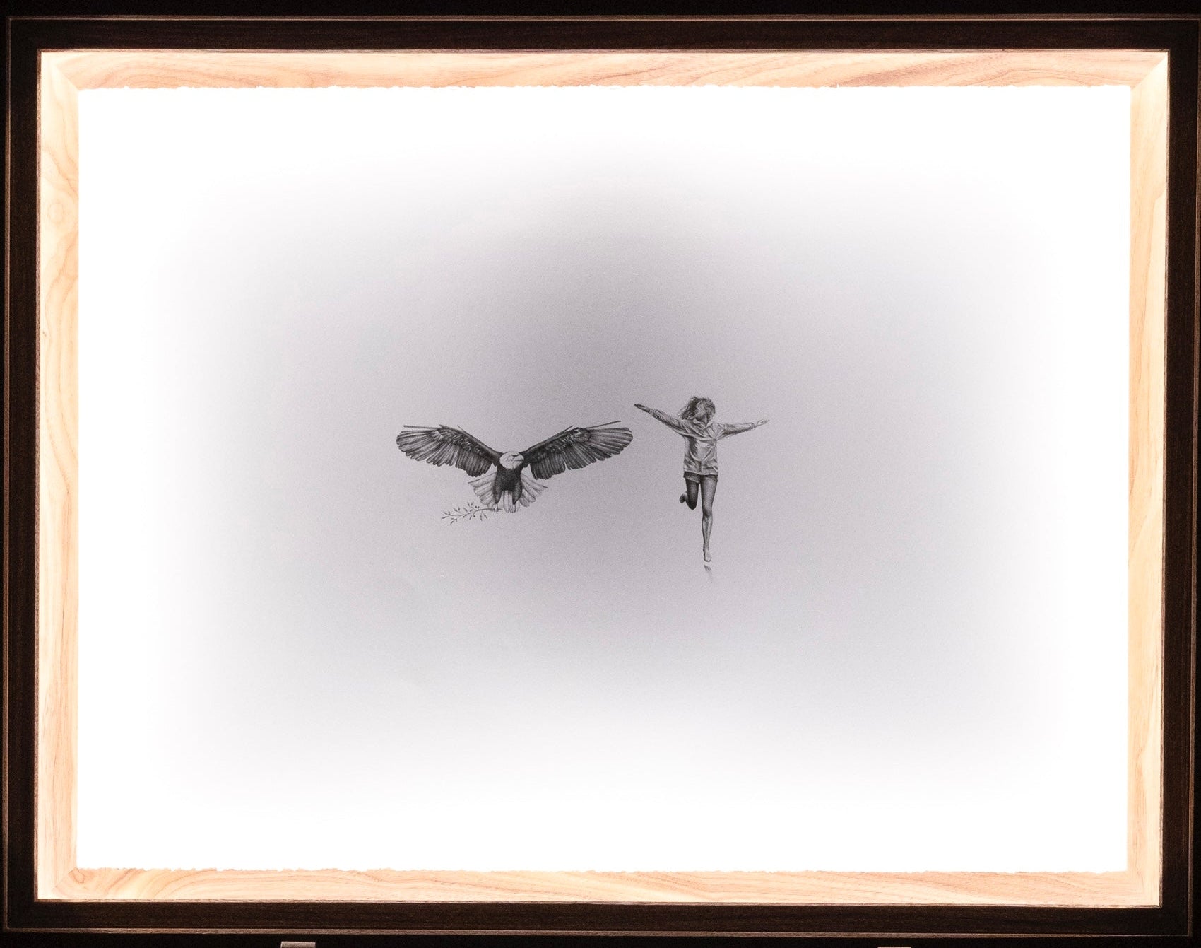 Graphite drawing of an eagle taking flight while a girl runs beside him with her arms outstretched, detail view — You Thought You Were Alone?, by Kate McDuffie